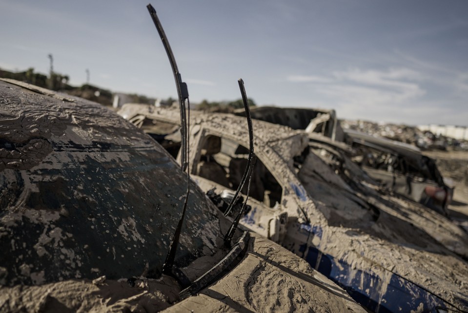 The mud looks to have hardened on the wrecked vehicles