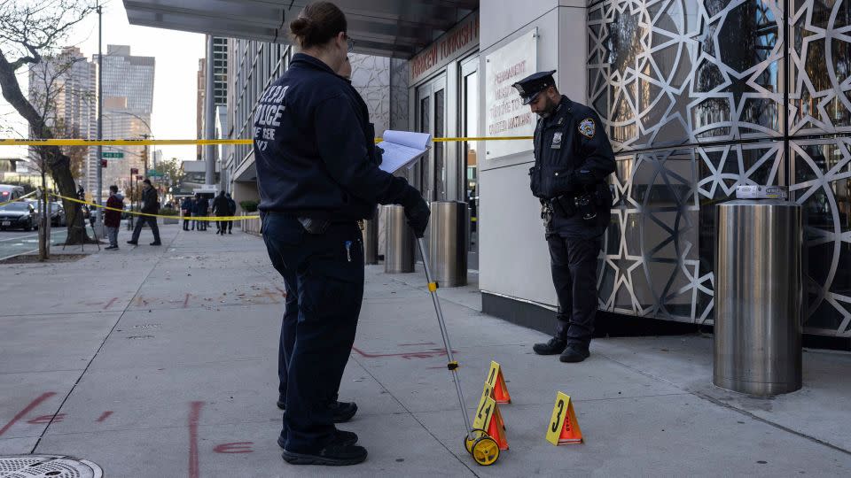 NYPD officers at the site where a suspect in a fatal stabbing spree was captured in Manhattan. - Yuki Iwamura/AP