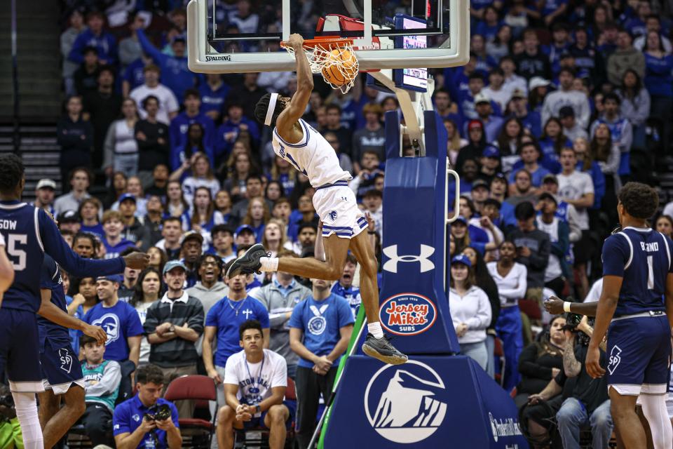 Nov 4, 2024; Newark, New Jersey, USA; Seton Hall Pirates guard Chaunce Jenkins (2) dunks the ball during the first half against the St. Peter's Peacocks at Prudential Center. Mandatory Credit: Vincent Carchietta-Imagn Images