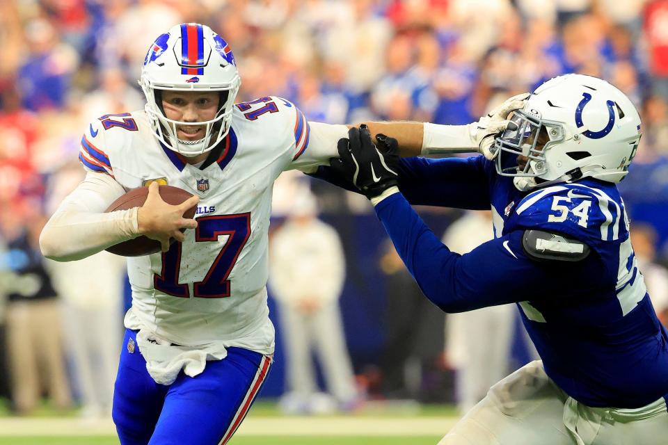INDIANAPOLIS, INDIANA - NOVEMBER 10: Josh Allen #17 of the Buffalo Bills stiff arms Dayo Odeyingbo #54 of the Indianapolis Colts during the fourth quarter at Lucas Oil Stadium on November 10, 2024 in Indianapolis, Indiana. (Photo by Justin Casterline/Getty Images)