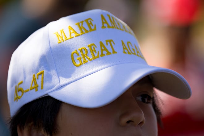 Trump supporters wore hats in support as they gathered at Album Park in East El Paso, Texas, before their fourth Trump train rally, which ended in Cornudas, Texas, on Saturday, Sept. 28, 2024.