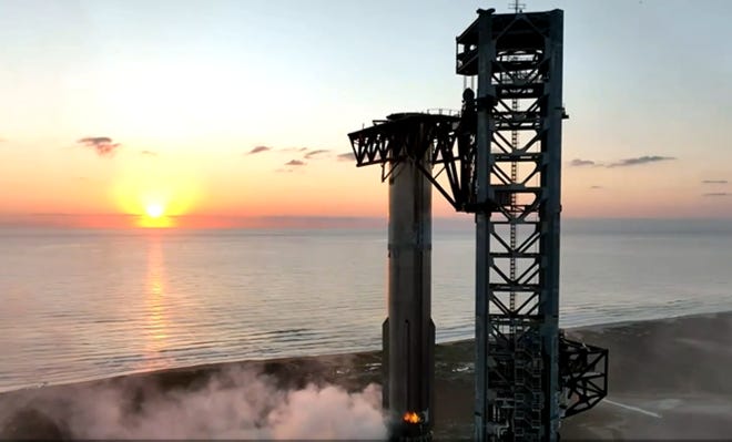 SpaceX caught the Super Heavy booster for the first time on Sunday, October 13. It sits in the Mechazilla arms on the launch pad post landing. This could be a scene in the near-future at Cape Canaveral. Photo from the SpaceX live stream.