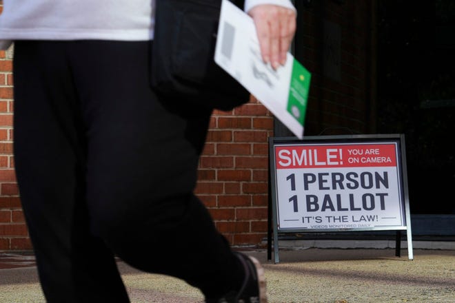 Pennsylvania residents turn in their early ballots at the Bucks County Courthouse Monday, Nov. 4, 2024, in Doylestown.