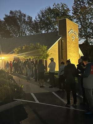 People lined up to vote before sunrise at Temple Beth Messiah, 4950 Morse Road on the Northeast Side. Doors opened promptly at 6:30 at the polling spot.