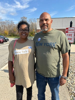 Raevena Davis, 52, (left) and David Davis, 57, (shown right) of Beech Grove stand outside a polling location at Beech Grove Middle School, 1248 Buffalo Street, after voting in the general election Tuesday, Nov. 5, 2024.