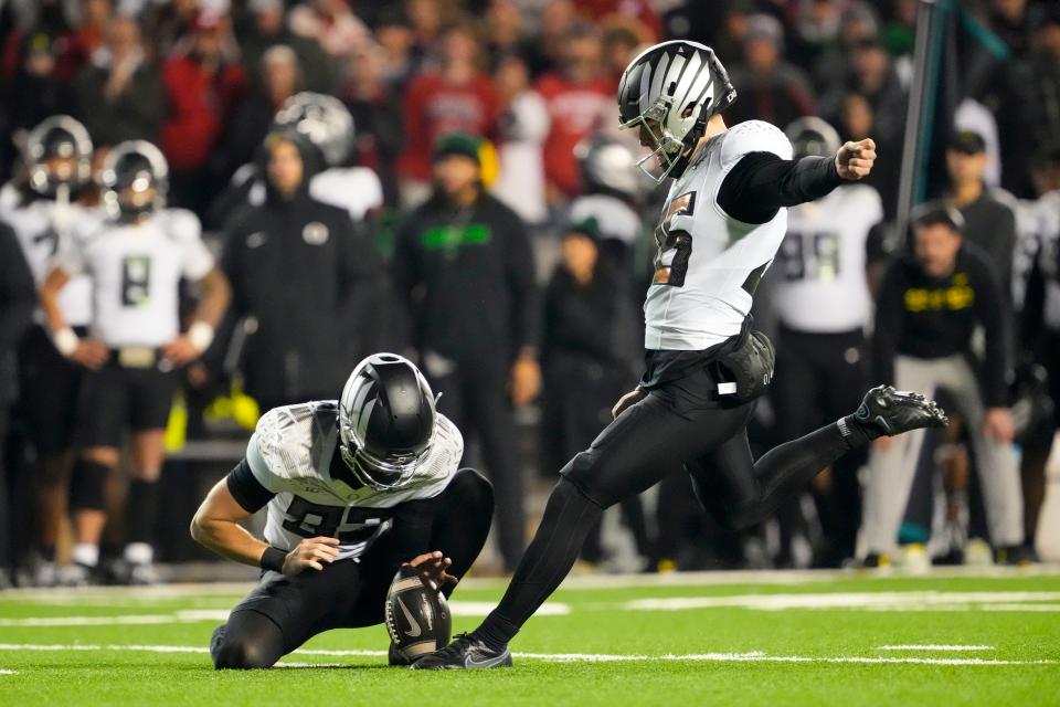 Nov 16, 2024; Madison, Wisconsin, USA; Oregon Ducks kicker Atticus Sappington (36) kicks a field goal during the fourth quarter against the Wisconsin Badgers at Camp Randall Stadium. Mandatory Credit: Jeff Hanisch-Imagn Images