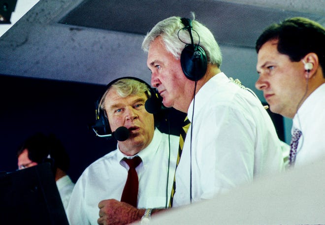 Former Oakland Raider head coach John Madden (left) and commentator Pat Summerall (right) at Texas Stadium during the regular season gem between the Dallas Cowboys and the Washington Redskins.