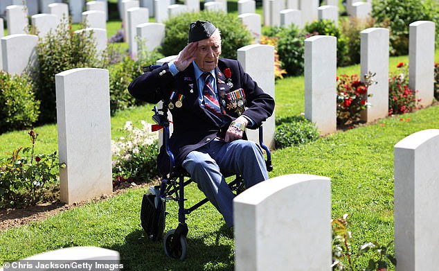 Ronald Hendrey salutes as he visits the headstone of a comrade at the Bayeux War Cemetery on June 5 this year. He is one of the few WW2 veterans who was able to attend the D-Day event