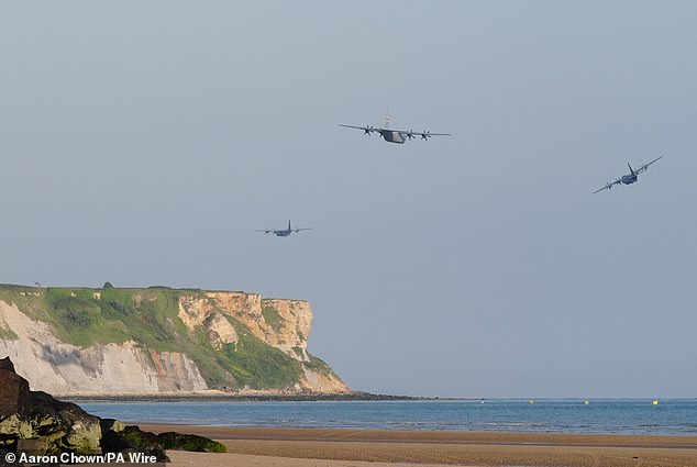 Military aircraft fly over the beach at Arromanches in Normandy as they travelled over the northern coast of France to mark the 80th anniversary of D-Day in June