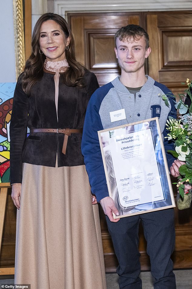 Mary beamed as she stood next to winners of the Children's Aid Day awards