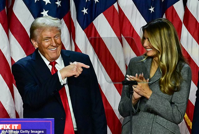 Former US President and Republican presidential candidate Donald Trump points to his wife former US First Lady Melania Trump during an election night event at the West Palm Beach Convention Center in West Palm Beach, Florida, early on November 6, 2024