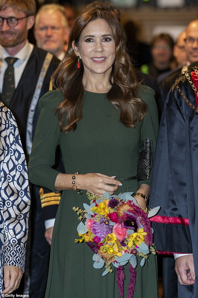 Queen Mary of Denmark was all smiles as she stepped out solo to attend a party at the University of Copenhagen on Friday
