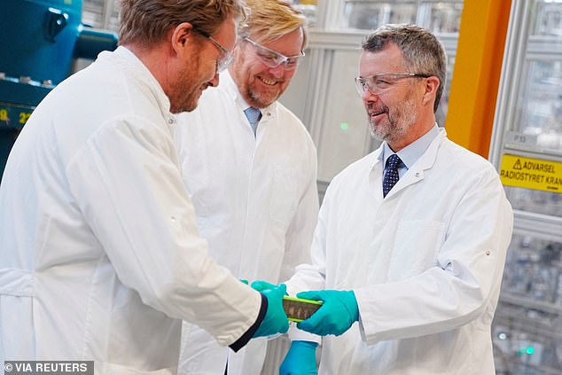King Frederik is handed an item by a scientist at Topsoe today