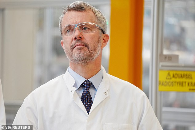 King Frederik donned goggles and a lab coat during the visit