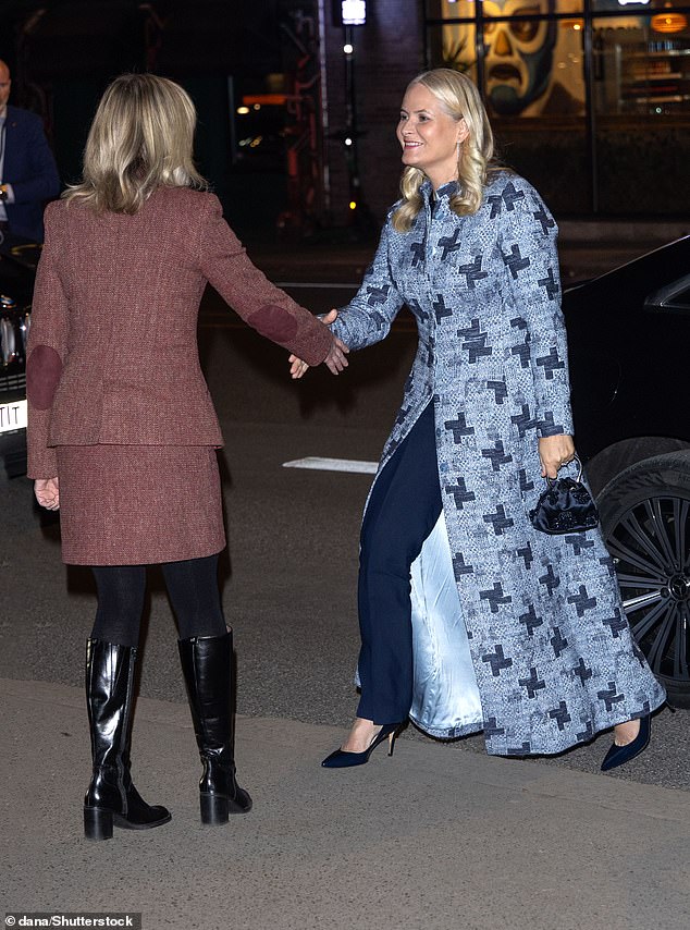 She clutched a small embellished Prada handbag, kept her makeup minimal and wore her blonde locks down her shoulders