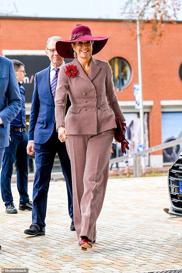 Queen Maxima of the Netherlands (pictured) out on a dazzling display today as she stepped out in red checkered suit to attend an event in Assen