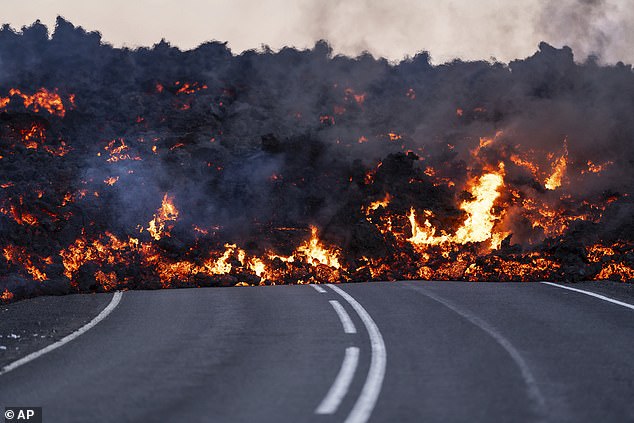 Active lava flows in front of the road that's en route to the Blue Lagoon near Grindavik
