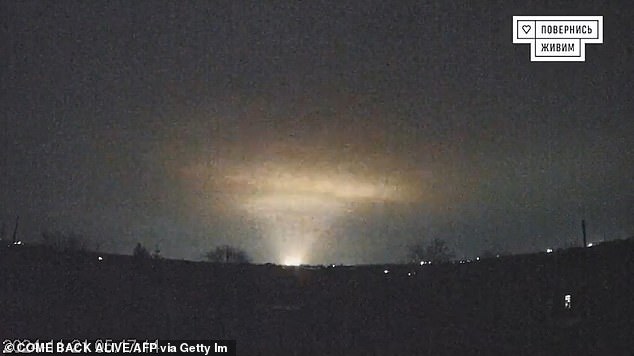 A grab taken from footage released online on November 21, 2024 by the Ukrainian charity "Come Back Alive" shows flashes over the Ukrainian city of Dnipro. Kyiv accused Russia of launching an intercontinental ballistic missile attack at Ukraine for the first time on November 21, 2024 but without a nuclear warhead