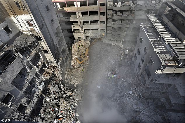 Rescue workers search for victims at the site of an Israeli airstrike that hit central Beirut