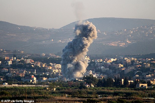 A photo taken from the southern Lebanese city of Tyre shows smoke as it rises from site of an Israeli airstrike that targeted the nearby village of Samaaiyeh