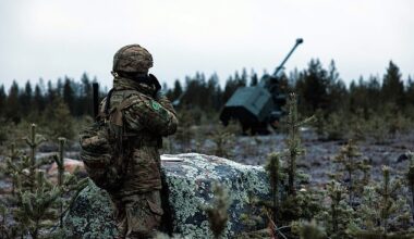 Gun line section commander Staff Sergeant Rai uses a radio to speak to Archer crews from 19th Regiment Royal Artillery NATO live fire drills in Finland called Exercise Dynamic Front