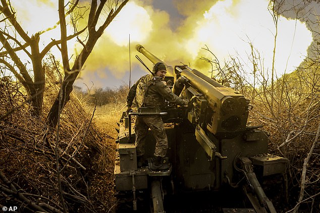 Ukrainian soldiers propell a howitzer towards Russian positions near Chasiv Yar, Donetsk region, Ukraine on November 18
