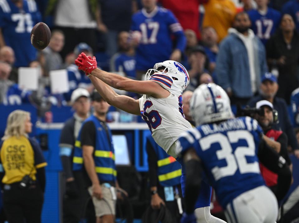 Nov 10, 2024; Indianapolis, Indiana, USA; Buffalo Bills tight end Dalton Kincaid (86) reaches for a pass that was overthrown in front of Indianapolis Colts safety Julian Blackmon (32) during the first quarter at Lucas Oil Stadium. Mandatory Credit: Marc Lebryk-Imagn Images