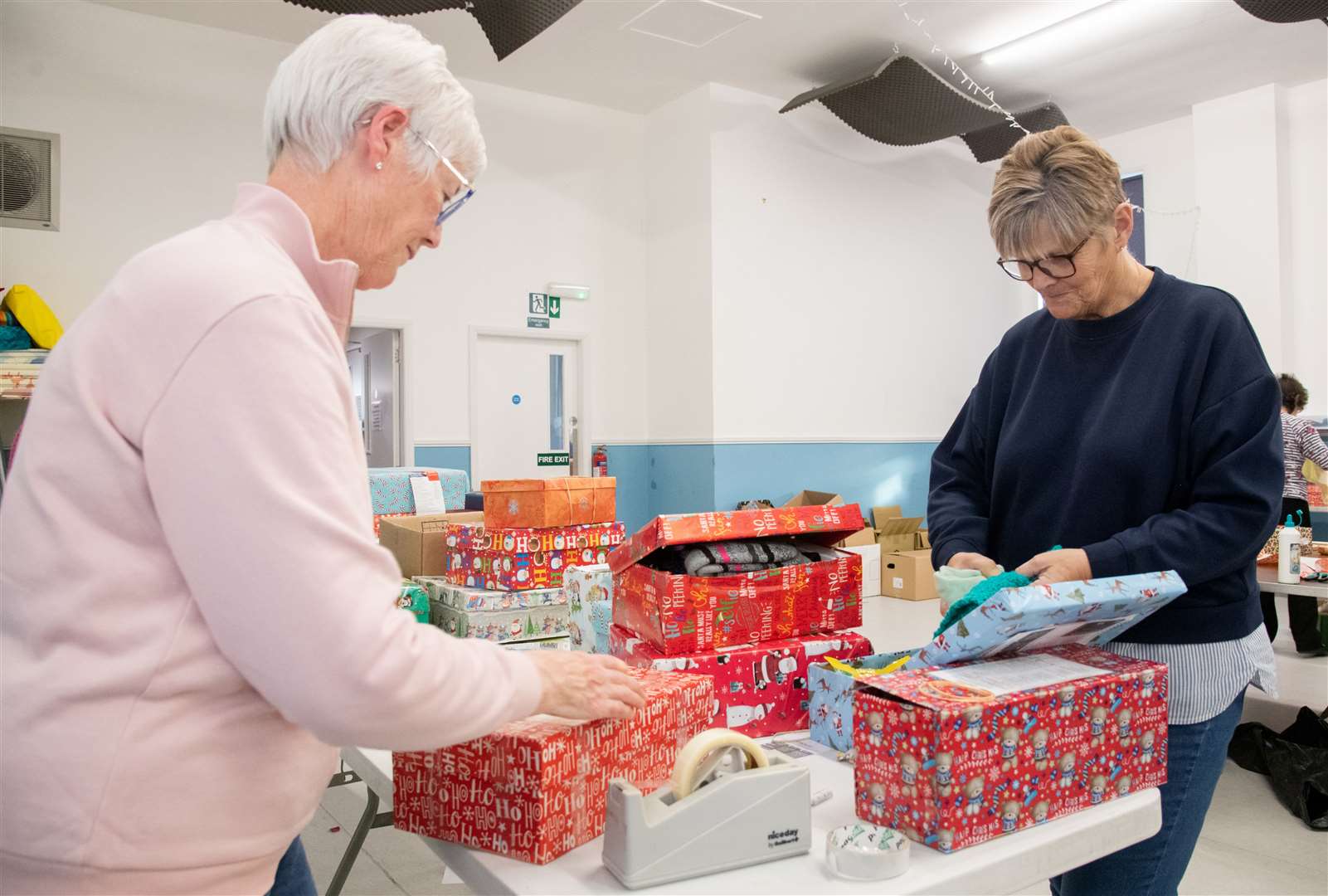 Volunteers help fill Christmas shoeboxes at the Buckie Baptist Church hall as part of the Blythswood appeal. Picture: Daniel Forsyth