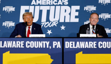 Donald Trump and Lee Zeldin stand side by side at lecterns