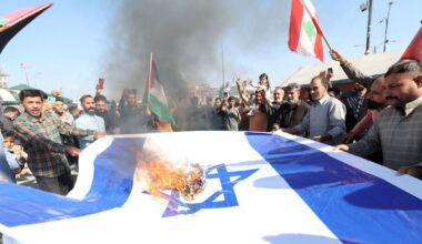 Supporters of Iraqi Shi'ite cleric Moqtada al-Sadr burn an Israeli flag in support of Palestinians in Gaza and Lebanon, after Friday prayers in Najaf, Iraq, November 15, 2024.
