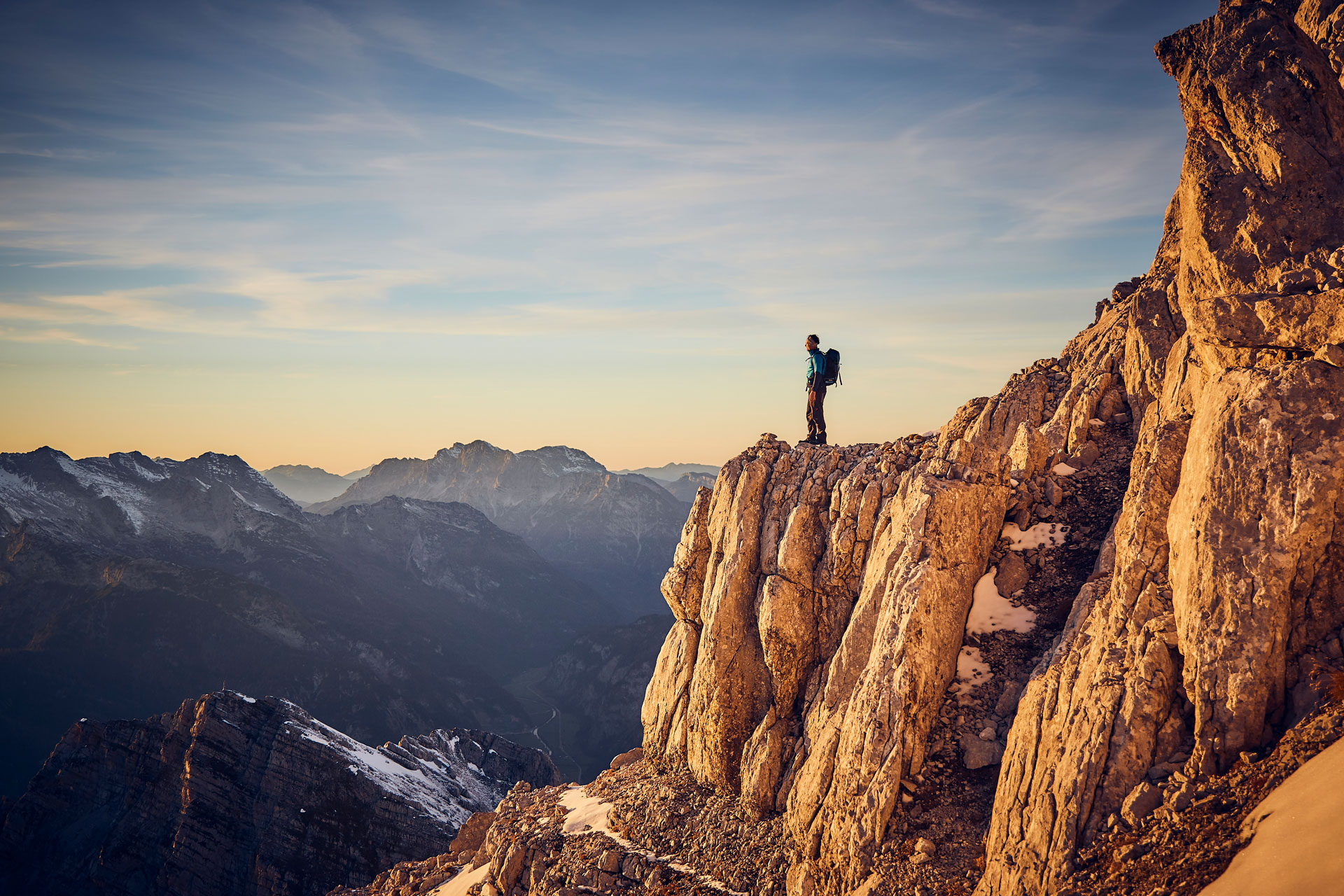 A person standing at the top of a mountain in Austria