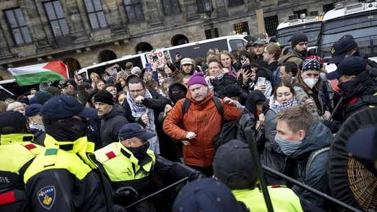 Protesters take part in a Pro-Palestinian demonstration on Dam Square in Amsterdam on November 10. The protest was taking place while an emergency ordinance and demonstration ban are in place in the city. These were previously deployed following tensions and violence surrounding supporters of Israeli football club Maccabi Tel Aviv. (AFP)(AFP)