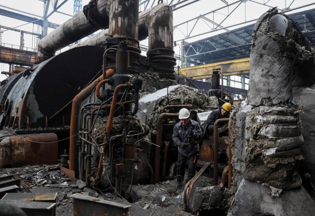 Workers fix a thermal power plant damaged by a Russian missile strike, amid Russia's attack on Ukraine, at an undisclosed location in Ukraine November 28, 2024. REUTERS/Gleb Garanich