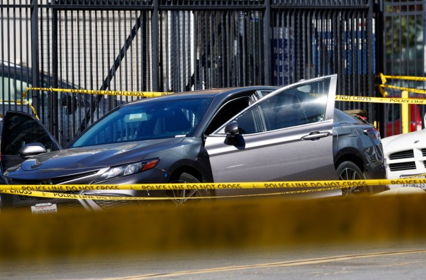Two people were shot and killed in this gray vehicle on Union Street near A Street on Wednesday, Nov. 13, 2024. (K.C. Alfred / The San Diego Union-Tribune)