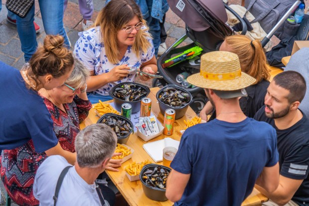 Moules et frites mussels and fries is a super-cheap meal washed down with beer and served during the Braderie in Lille, a 48-hour flea market in the French city near the border with Belgium. (Laurent Javoy)