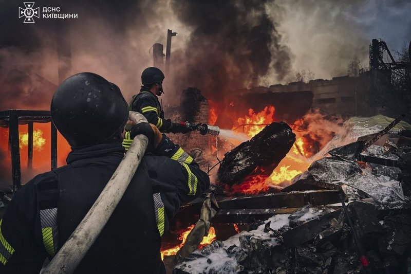 Ukrainian rescuers work at the site of a Russian strike on a building in the city of Brovary near Kyiv on Nov. 13 amid the ongoing Russian invasion, which Ukrainian President Volodymyr Zelensky on Friday suggested could end if Ukraine became a NATO member. Photo by the Security Service of Ukraine/EPA-EFE