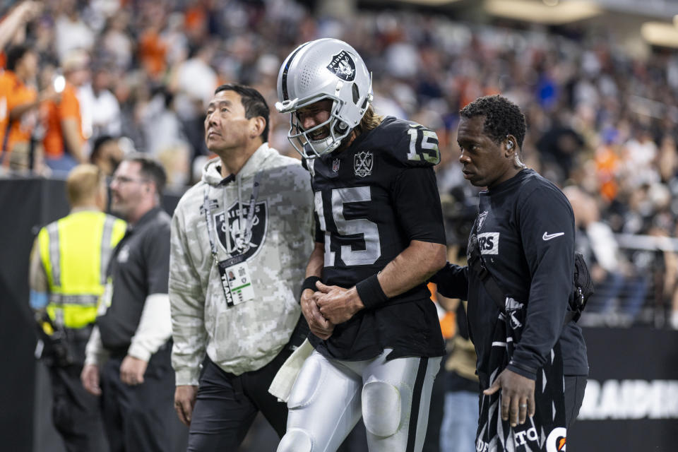 LAS VEGAS, NEVADA - NOVEMBER 24: Gardner Minshew #15 of the Las Vegas Raiders reacts to an apparent injury as he’s helped off the field during an NFL Football game against the Denver Broncos at Allegiant Stadium on November 24, 2024 in Las Vegas, Nevada. (Photo by Michael Owens/Getty Images)