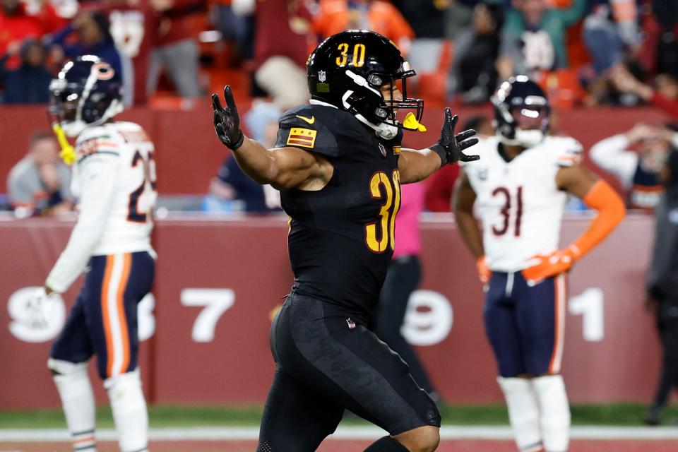 Oct 27, 2024; Landover, Maryland, USA; Washington Commanders running back Austin Ekeler (30) celebrates after the final play of the game against the Chicago Bears at Northwest Stadium. Mandatory Credit: Geoff Burke-Imagn Images