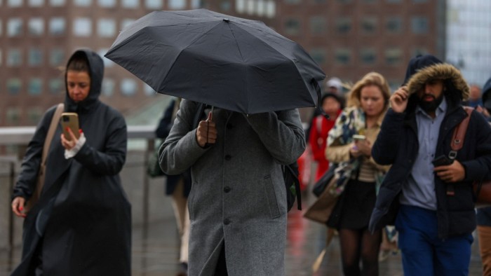 Commuters crossing London Bridge