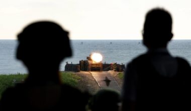 Two Taiwanese soldiers watch a vehicle fire US-made missiles at a target during a shooting exercise in Fangshan last month
