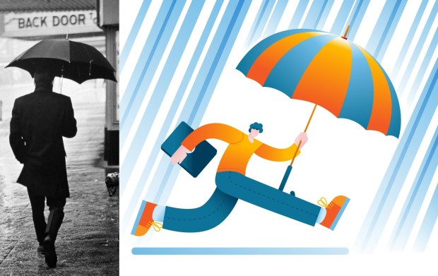 Though I felt like the cool guy in the rain on the left, I'm pretty sure I was skipping along in the rain with my new books. (Getty Images)