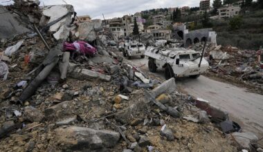 A South Korean U.N peacekeeper patrol drive past destroyed buildings in Chehabiyeh village, southern Lebanon, Thursday, Nov. 28, 2024 following a ceasefire between Israel and Hezbollah that went into effect on Wednesday. (AP Photo/Hussein Malla)