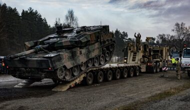 NATO Multinational Brigade - Latvia Logistics Unit loading Leopard 2PL tanks onto military transport...