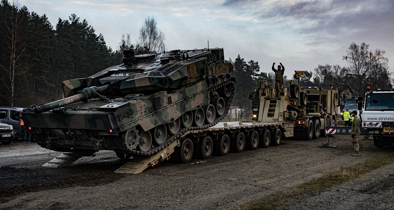 NATO Multinational Brigade - Latvia Logistics Unit loading Leopard 2PL tanks onto military transport...