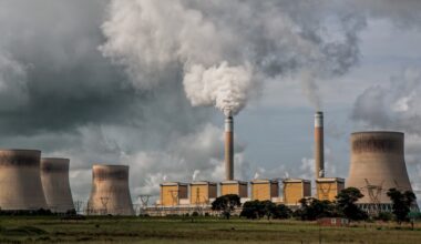 A power station, with chimneys releasing smoke