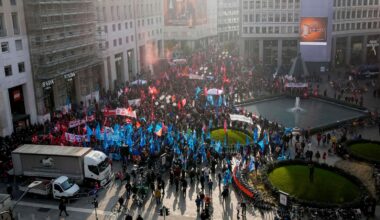 Thousands of workers march across Italy in general strike demanding better pay and services