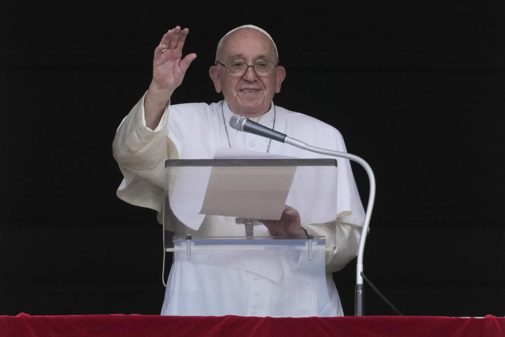 Pope Francis delivers his blessing as he recites the Angelus noon prayer from the window of his studio overlooking St.Peter’s Square, at the Vatican, Sunday, Sept. 11, 2022. (AP Photo/Andrew Medichini)