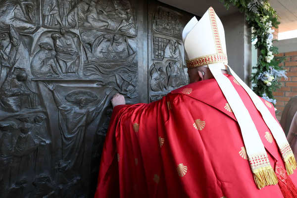 Pope Francis opens a Holy Door, one of only five that will be open during the 2025 Catholic Holy Year, at Rebibbia prison, in Rome, Italy, December 26, 2024. Vatican Media/Francesco Sforza Handout via REUTERS Pope Francis opens a Holy Door at Rebibbia prison, in Rome