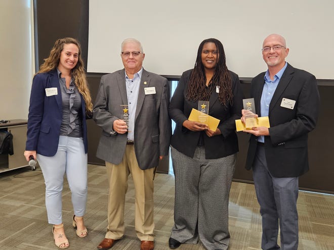 The 211 Brevard Space Coast Supernova Award was presented by Heather Branly of SCCU to, representing their agencies, left to right: Neal Hagglund, Salvation Army North Central; Valeta Cameron, Brevard County Legal Aid; and Tom Kammerdener, Aging Matters in Brevard.