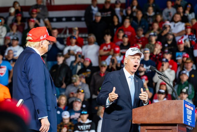 Republican U.S Sen. Ron Johnson joins former President Donald J. Trump on stage at a rally at the Dodge County Airport on Sunday October 6, 2024 in Juneau, Wis.